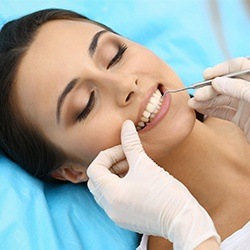 Woman receiving dental treatment