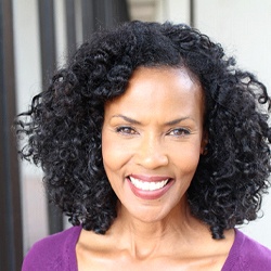 woman smiling with the benefits of dentures