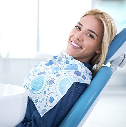 Smiling woman in dental chair