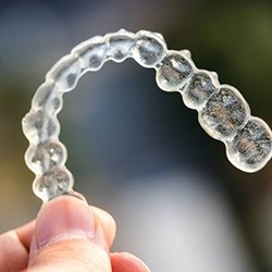 Closeup of Invisalign in Myrtle Beach on colorful outside background