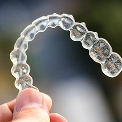 Closeup of Invisalign on colorful outside background