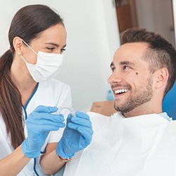 Cosmetic dentist and patient discuss Invisalign