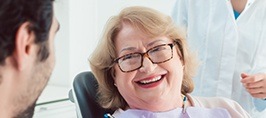 Smiling older woman in dental chair